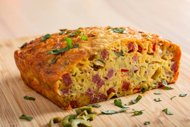 Salted cake Salted cake made from eggs, cheese, olives, salami, mushrooms and red pepper pepper cake stock pictures, royalty-free photos & images