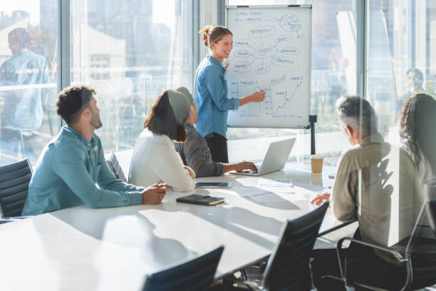 istock Business people watching a presentation on the whiteboard. 1329584658