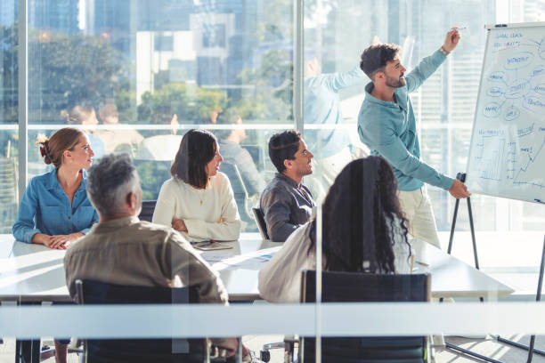istock Business people watching a presentation on the whiteboard. 1329584659