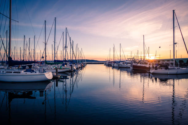 Sailboats Docked in Marina During Sunset Sunset at Des Moines Marina, WA sound port stock pictures, royalty-free photos & images