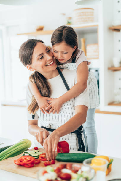 istock Mother and daughter in the kitchen 1329591662