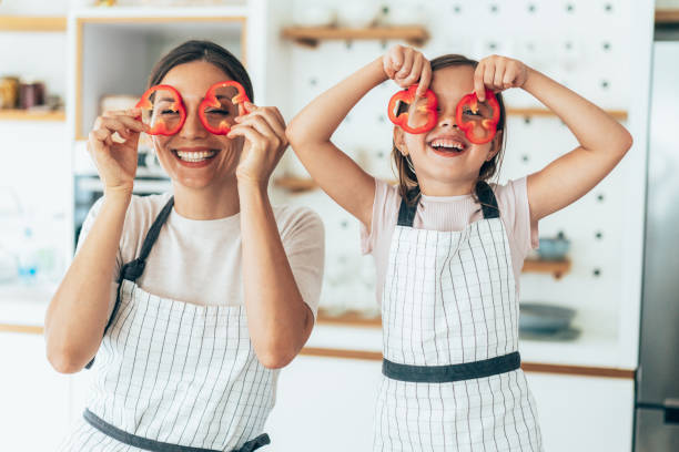 istock Mother and daughter in the kitchen 1329592211