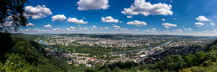 Panoramic aerial view of Trier on beautiful summer day with blue sky and clouds from viewpoint Marian column, Germany