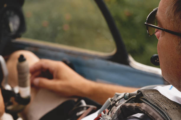 istock Mature glider pilot in the airplane before flight in fixed-wing plane 1329596176