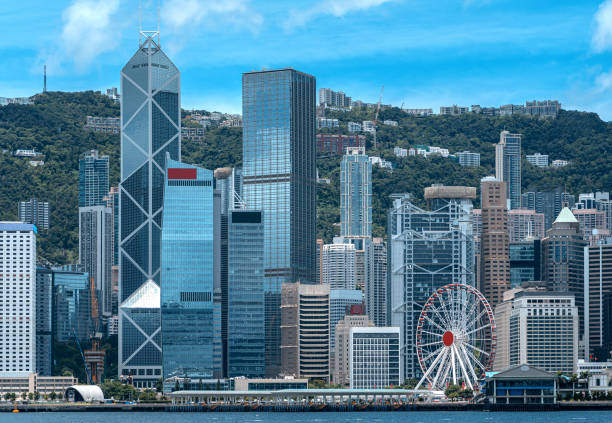 Panorama of Victoria Harbor of Hong Kong at sunny day Panorama of Victoria Harbor of Hong Kong at sunny day central district hong kong stock pictures, royalty-free photos & images