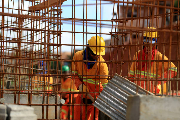 salvador, bahia, barazil - march 23, 2017: Worker handles iron construction work in the city of Salvador.