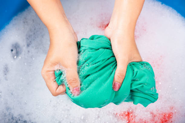 istock Female squeeze wring out wet fabric cloth 1329602358