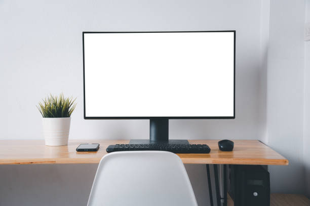 istock Computer monitor with white blank screen on the business desk 1329602369