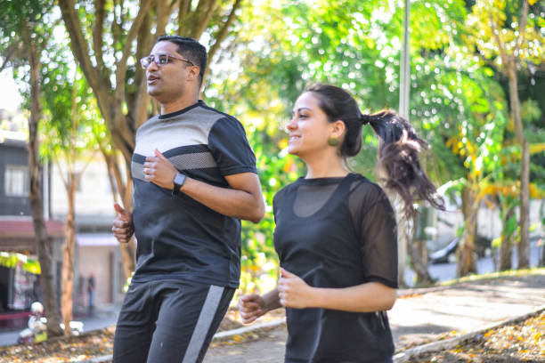 istock Young couple jogging together 1329602524