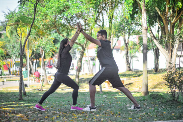 istock Young couple exercising together 1329603131