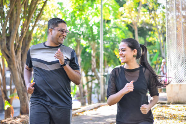 istock Young couple exercising together 1329603293