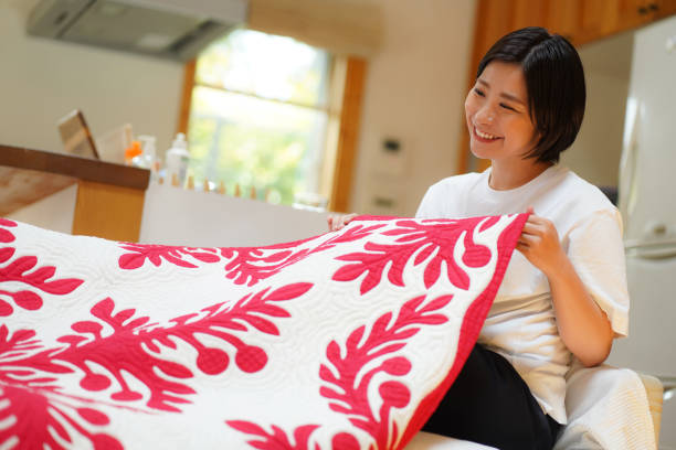 istock A woman making a Hawaiian quilt 1329603975