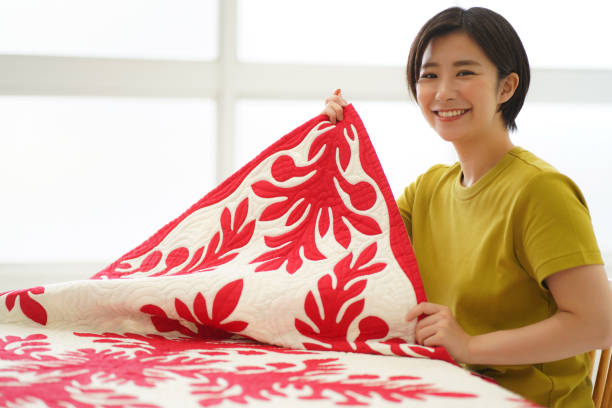 istock A woman making a Hawaiian quilt 1329604004