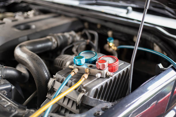 istock Car air conditioner check service, leak detection, fill refrigerant.Device and meter liquid cooling in the car by specialist technicians. 1329604713