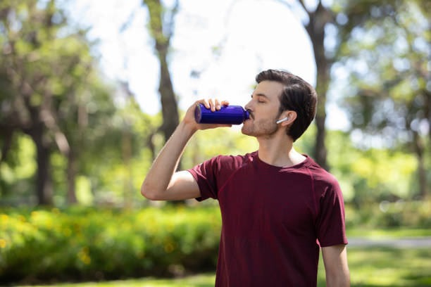 istock Young man exercising outdoors 1329605618