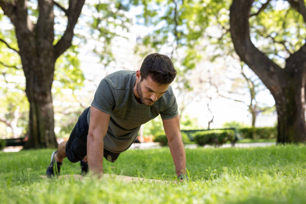 istock Young man exercising outdoors 1329605630