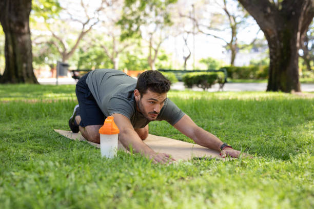 istock Young man exercising outdoors 1329605635