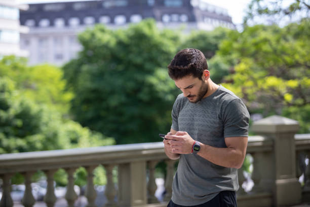 istock Young man using phone at Buenos Aires town square 1329606232