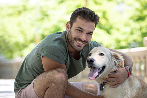 Handsome young man with a retriever dog at Buenos Aires - Argentina