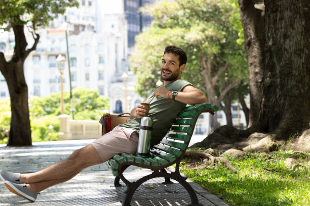 istock Young man drinking mate at Buenos Aires square 1329606322