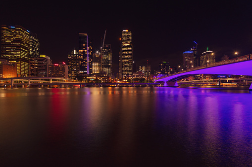 Brisbane’s city skyline at night, with lights reflected on the Brisbane River. The Queensland capital is the likely host of the 2032 Olympic Games.