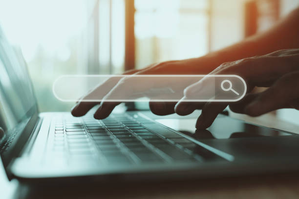 istock Searching information data on internet networking concept. Male hand typing text on laptop keyboard 1329608148