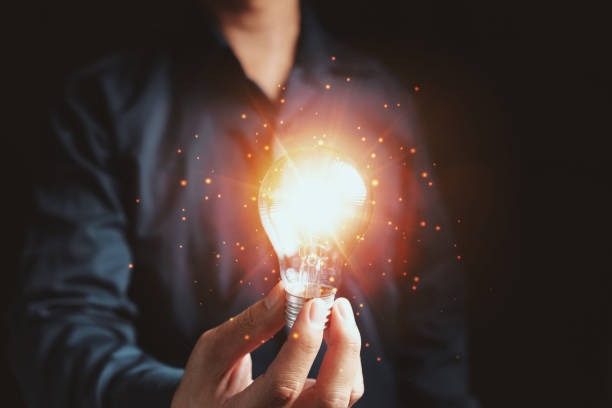 istock Hand holding light bulb. idea with innovation and inspiration concept 1329608474