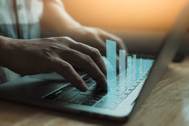 istock Businessman use laptop, analytics and financial and bank technology concept, chart from computer laptop, Business growth concept 1329608500
