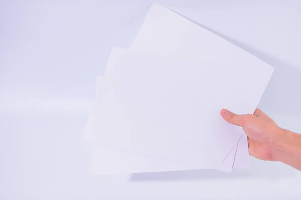 istock The business man is holding the document on the white background 1329611930