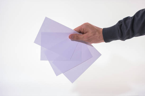 istock The business man is holding the document on the white background 1329611979