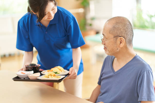 istock Caregiver serving the elderly 1329615314