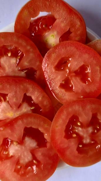 istock sliced tomato close-up 1329616304