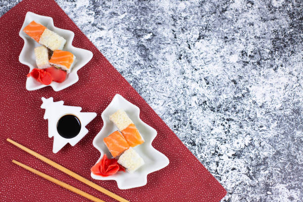 istock Sushi set in plate as Christmas tree on festive background. 1329621437