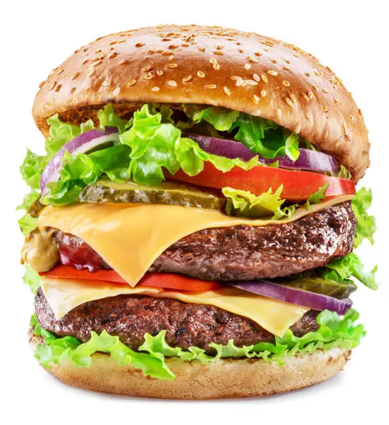 Photo of Delicious hamburger with beef cutlet, vegetables and onions isolated on a white background. Fast food concept.