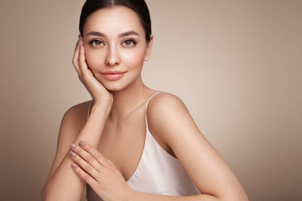 Portrait beautiful young woman with clean fresh skin Portrait beautiful young woman with clean fresh skin. Model with healthy skin, close up portrait. Cosmetology, beauty and spa beauty treatments stock pictures, royalty-free photos & images