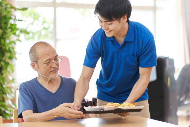 istock Caregiver serving the elderly 1329622740