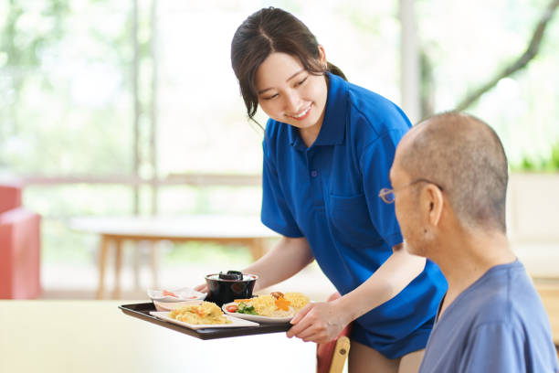 istock Caregiver serving the elderly 1329622743