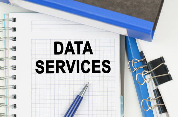 istock Among the documents, folders, a notebook with the inscription - DATA SERVICES 1329622824