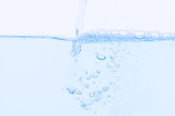 istock Light blue bubbles and water White background 1329624458
