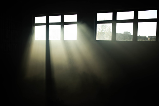 Sunlight entering through windows in a basement. Copy space.