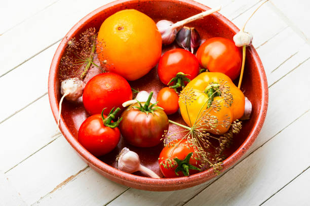 istock Raw tomatoes and ingredients for cooking pickled tomato 1329628084