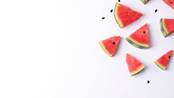 istock Slices of fresh watermelon on white background with copy space. 1329632135