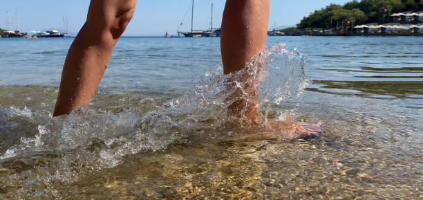 woman walking in the sea, close up