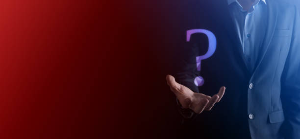 istock Businessman man hand hold interface question marks sign web. Ask quiestion online, FAQ concept, what where when how and why, search information on internet 1329633379
