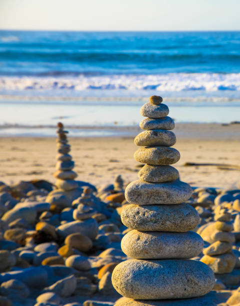 istock Stack of zen stones on pebble beach. Beach landscape. 1329635402
