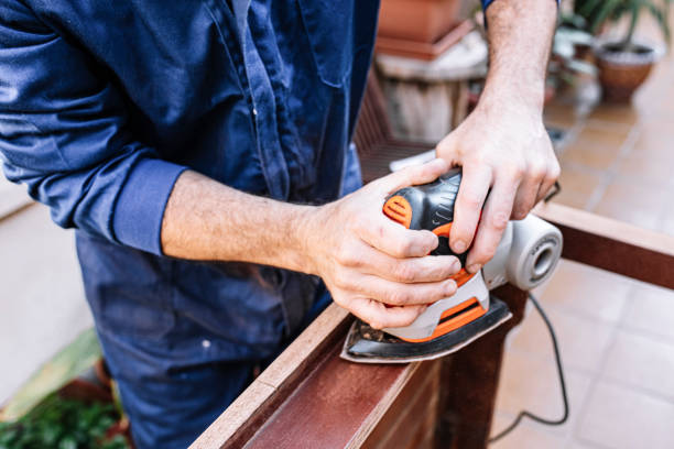 istock white caucasian man sanding wooden table, selective focus 1329639592