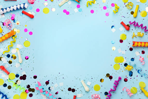 istock Frame made with carnival items on light blue background, flat lay. Space for text 1329639602
