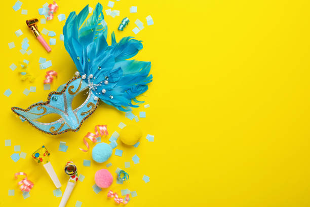 istock Flat lay composition with carnival items on yellow background. Space for text 1329639760