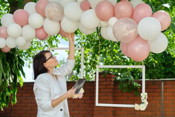 istock Decorating the garden with balloons for a party, ceremony 1329641145