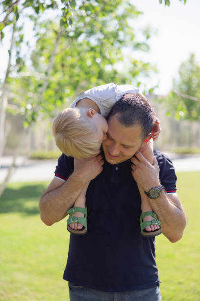 istock Son kissing dad on the cheek 1329641440